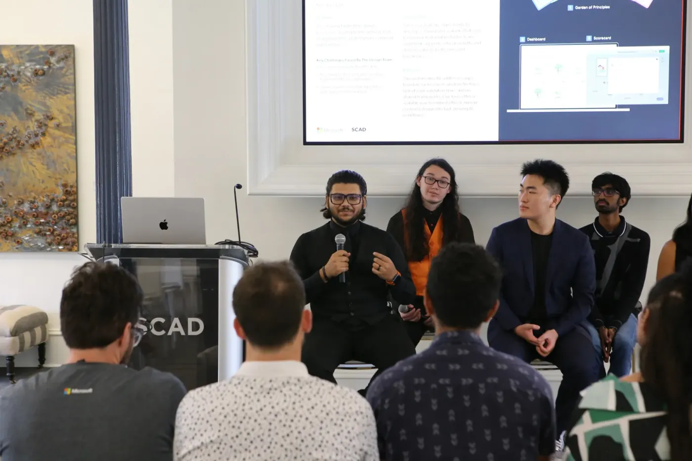 The team answering questions from Microsoft stakeholders after the presentation