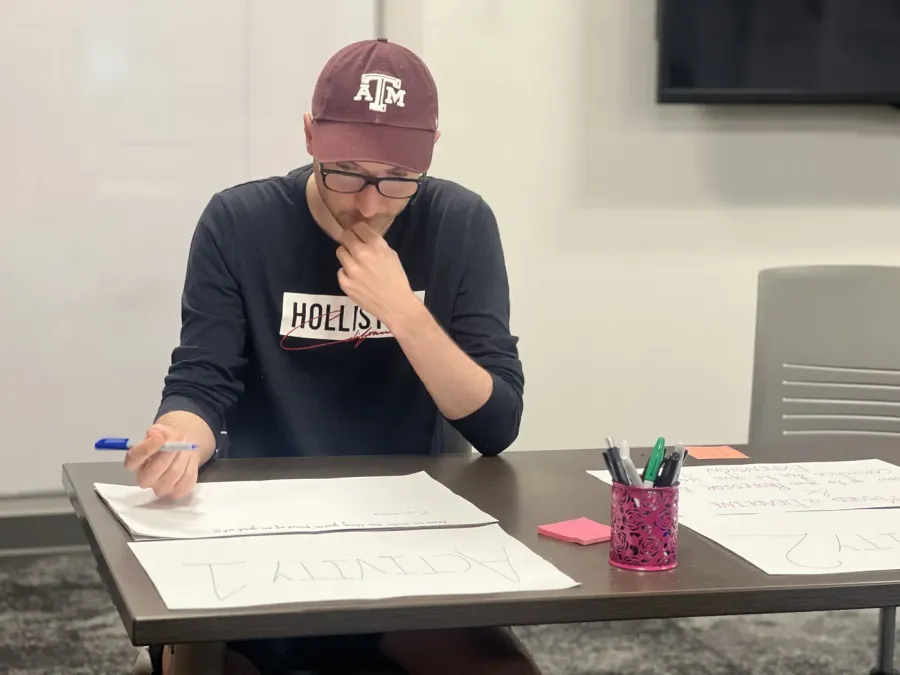 A participant writing his three portfolio skills
